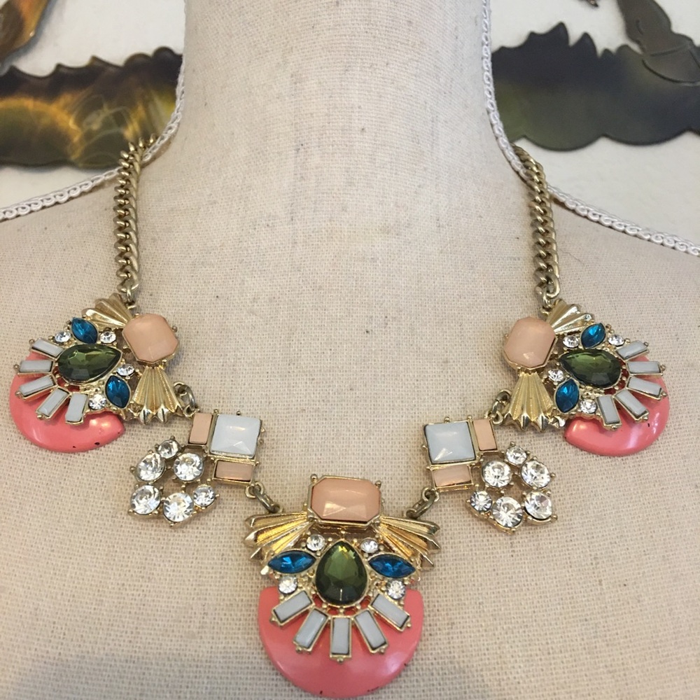 Multi colored jeweled disc gold tone necklace